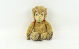 Vintage Monkey Plush Toy Jointed monkey toy with blue glass eyes brown chenille paws and cream