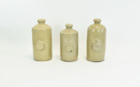 A Collection of Stoneware Hot Water Bottles from the 1940's (see photos. 10.75 inches high and 9.