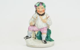 Staffordshire Figure of a Sailor Drinking Sat on a beer barrel, 6.5 inches high.