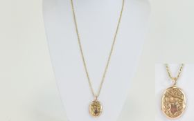 A Vintage 9ct Gold Oval Shaped Hinged Locket with attached 9 carat gold long chain.