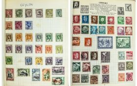 Red spring back stamp album. Well filled