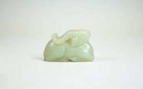 A Chinese Qing Dynasty White Jade Lamb. 85.4 grams. 1.5 x 2.25 Inches.