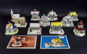 Coalport Hand Painted Cottages Eleven in total,