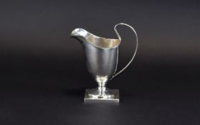 Victorian - Late Helmet Shaped Milk Jug with Reeded Borders Raised on a Square Base.