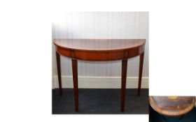 Georgian Flame Mahogany Half Moon Table with marquetry inlay and cross banding to top. Raised on
