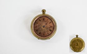 Pocket Watch Late 19th century brass cased watch with floral and foliate embossed case.