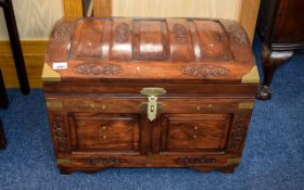 Carved Wood Chest Ornamental dark wood chest in Anglo Indian style.