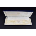 A Vintage - Nice Quality Single Strand Cultured Pearl Necklace with 9ct Gold Pearl and Garnet Clasp,