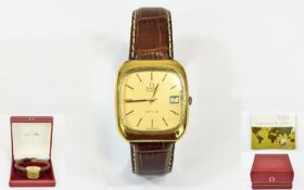 Omega Deville Gold Plated Quartz Day Just Gents Wrist Watch on an attached tan leather strap,