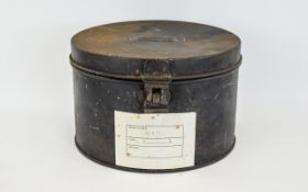 Military Interest Antique Metal Hat/Helmet Box Of cylindrical form with hinged lid and aged patina.