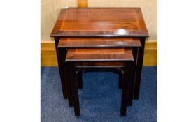 Nest Of Tables Dark wood with fine ribbon inlay to top. Three in total. Approx dimensions 20.