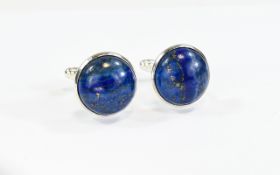 Lapis Lazuli Cufflinks Circular stone cufflinks in jeweled cardboard presentation box.