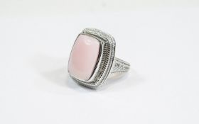Pink Opal Cabochon Ring, an elongated cushion cut cabochon of pink opal, measuring 11.
