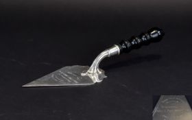 A 1930's Commemorative - Shaped Triangular Bladed Silver Trowel with Ebony Handle.