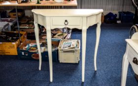 Console Table Contemporary cream painted wood table of semi circular form with central drawer.