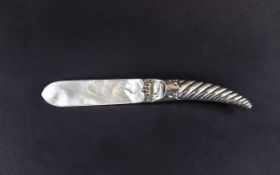 A Victorian Silver Handle and Mother Of Pearl Letter Opener Of Unusual Form.