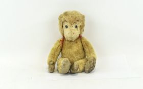 Vintage Monkey Plush Toy Jointed monkey toy with blue glass eyes brown chenille paws and cream