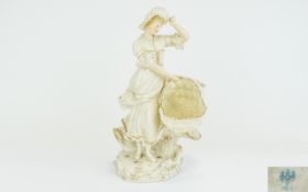 German Porcelain Figure of a Young Woman, carrying a large woven basket, the woman holding onto
