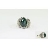 Emerald Solitaire Ring, a pear cut emera