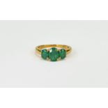 Emerald Three Stone Ring, an oval cut em