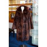 Musquash Fur Coat Mid length coat with side seam pockets,