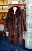 Musquash Fur Coat Mid length coat with side seam pockets,