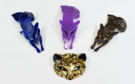 Four Lea Stein Brooches, three being foxes, one deep blue lustre,