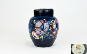 W. Moorcroft Tubelined Lidded Ginger Jar ' Anemone ' Design on Blue Ground.