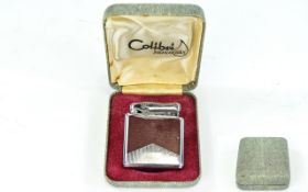 Vintage Boxed Colibri Mono Gas Lighter Silver tone metal with textured claret panels to front and