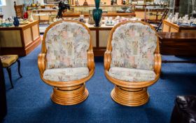 Conservatory Chairs Two in total fashioned from varnished, light bamboo effect bent wood.