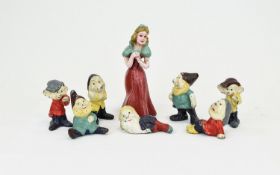 Snow White and The Seven Dwarfs Hand Painted Set of Lead Metal Figures from the 1920's.