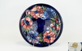 W. Moorcroft Tubelined Footed Bowl / Dish ' Anemone ' Design on Blue Ground. Label to Base Reads -