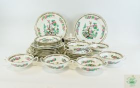 Part Teaset in the style of Indian Tree comprising dinner plates, 2 handled soup bowls,