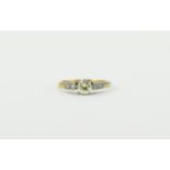 18ct Gold Set Single Diamond Ring with Six Small Diamonds to Shoulders. Diamond of Good Colour.