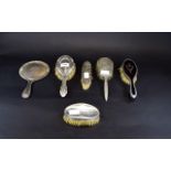 Collection of Silver Backed Brushes and Mirror, comprising three dressing table hair brushes,