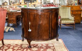 Drinks Cabinet Large dark wood crescent shaped cabinet with curved front and lockable door with