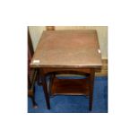 Occasional Table Small dark wood table in rustic style with bottom stretcher and planished copper