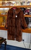 Mink Coat Russet mink mid length vintage coat. Fashioned in pieced pelts, all in very good