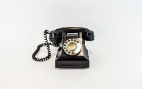 A TYPE 328F BLACK BAKELITE TELEPHONE, impressed mark 164 - 50. Wired for modern use.