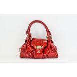 Russell And Bromley Top Handle Turnlock Leather Handbag Fashioned in soft red patent kid leather