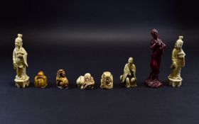 Collection of Faux Ivory Netsukes, one showing a dragon dog, the other four, Immortals, plus two