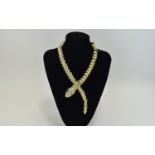 White Crystal Gilt Snake Necklace, an articulated gilt snake, studded with white crystals,