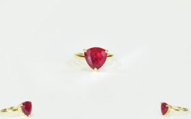 Ruby Trillion Solitaire Ring, an 8ct ruby, in the unusual trillion cut, raised on an openwork