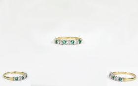 9ct Yellow Gold Set Seven Stone Emerald and Diamond Dress Ring. Fully Hallmarked. As New Condition.