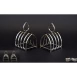 George V Pair of Silver Arched Shaped 4 Tier Toast Racks with a Hallmark for Birmingham 1930,
