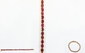 Ruby Tennis Bracelet, 28cts of oval cut rubies, set over 24 stones, making each just under 1ct,