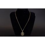 Antique 9ct Gold Pendant and Chain. The Pendant Set with Tear Drop Shaped Amethyst and Pearl.