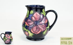 Walter Moorcroft Tube lined Globular Shaped Jug ' Anemone ' Design on Cobalt Blue Ground,