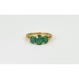 Emerald Three Stone Ring, an oval cut em