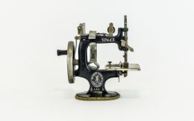 Vintage Singer Miniature Sewing Machine Small salesmans model/childs toy sewing machine by singer.